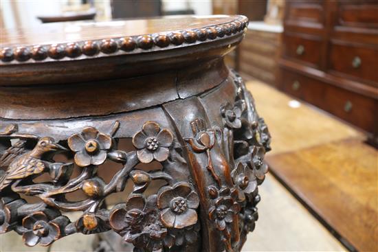 A pair of 19th century Chinese carved hardwood jardiniere stands